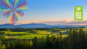 panorama över frösön med fjällen i horisonten